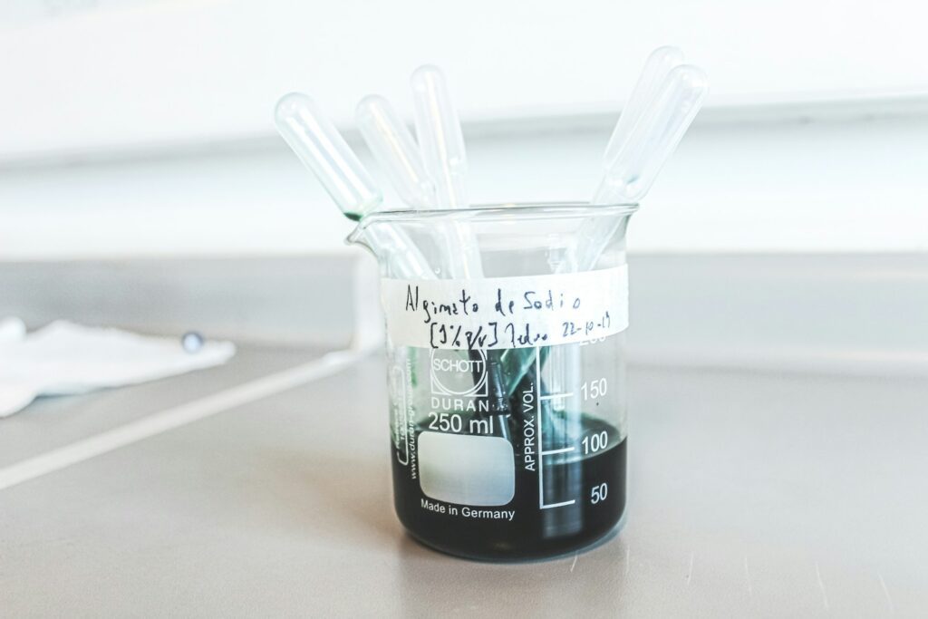 a beakle filled with liquid sitting on top of a table